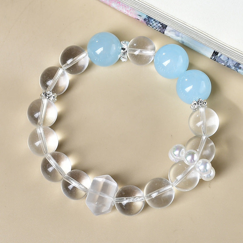 A close-up of the transparent texture of white crystal highlights its core function of purifying negative energy