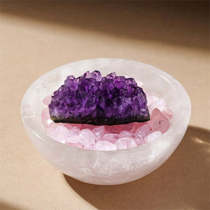 A person holding the bowl in their hands, intuitively selecting a small crystal to hold for anxiety relief.