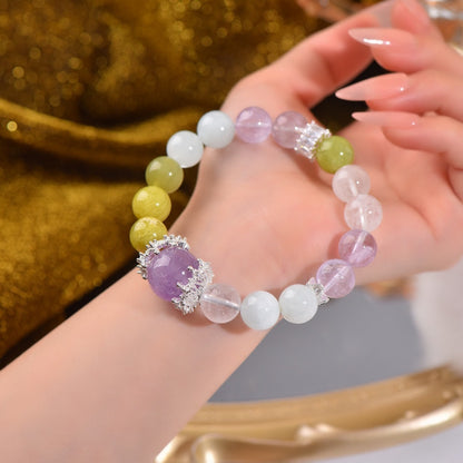 The completed bracelet in the desk scene serves as an energy tool for purifying the space and enhancing concentration