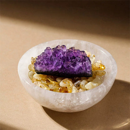  Close-up of the Raw Crystal Cleansing Bowl showing the textured Clear Quartz and luminous Selenite stones on a silk cloth.