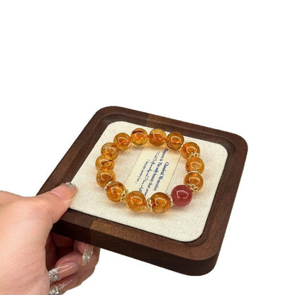 A close-up of the soft pink color of strawberry crystal showcases its energy characteristic of attracting love and enhancing popularity