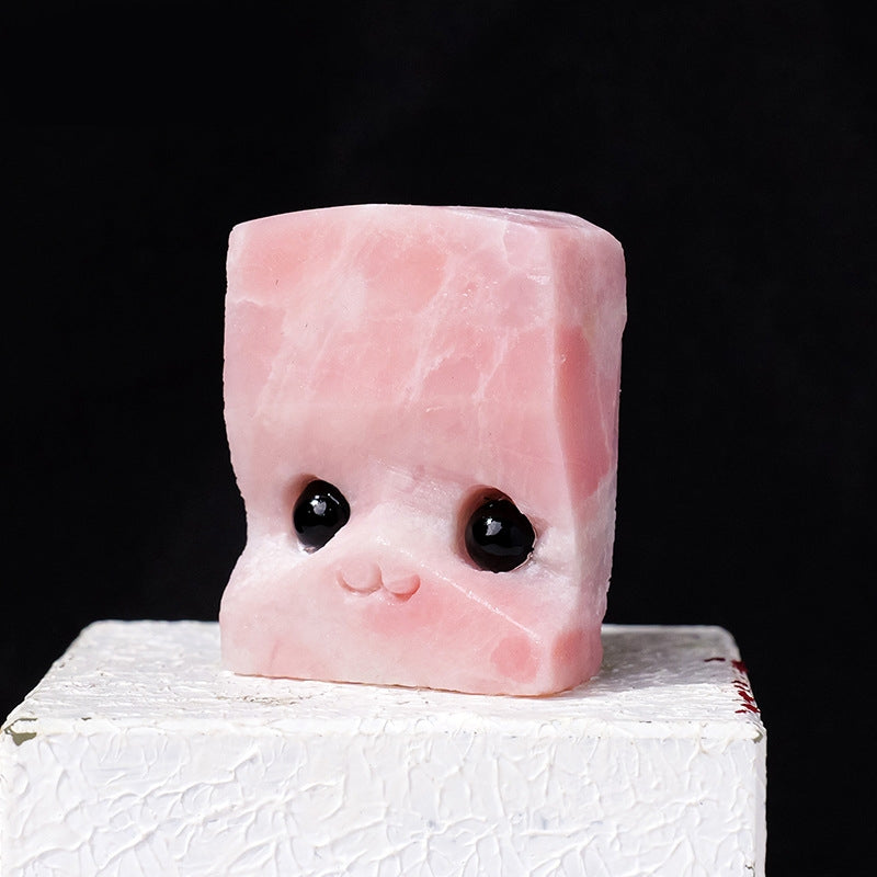 Hedgehog figurines placed together with sketchbooks and colored pencils inspire artistic creation.