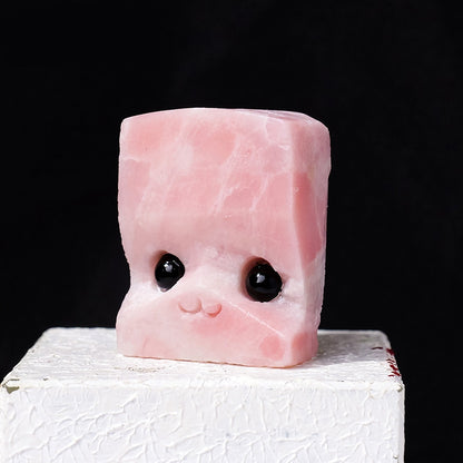 Hedgehog figurines placed together with sketchbooks and colored pencils inspire artistic creation.