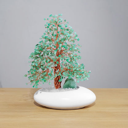 The crystal tree sparkles under the soft light, showcasing its crystal-clear texture and the ability to enhance the aesthetic appeal of the space.