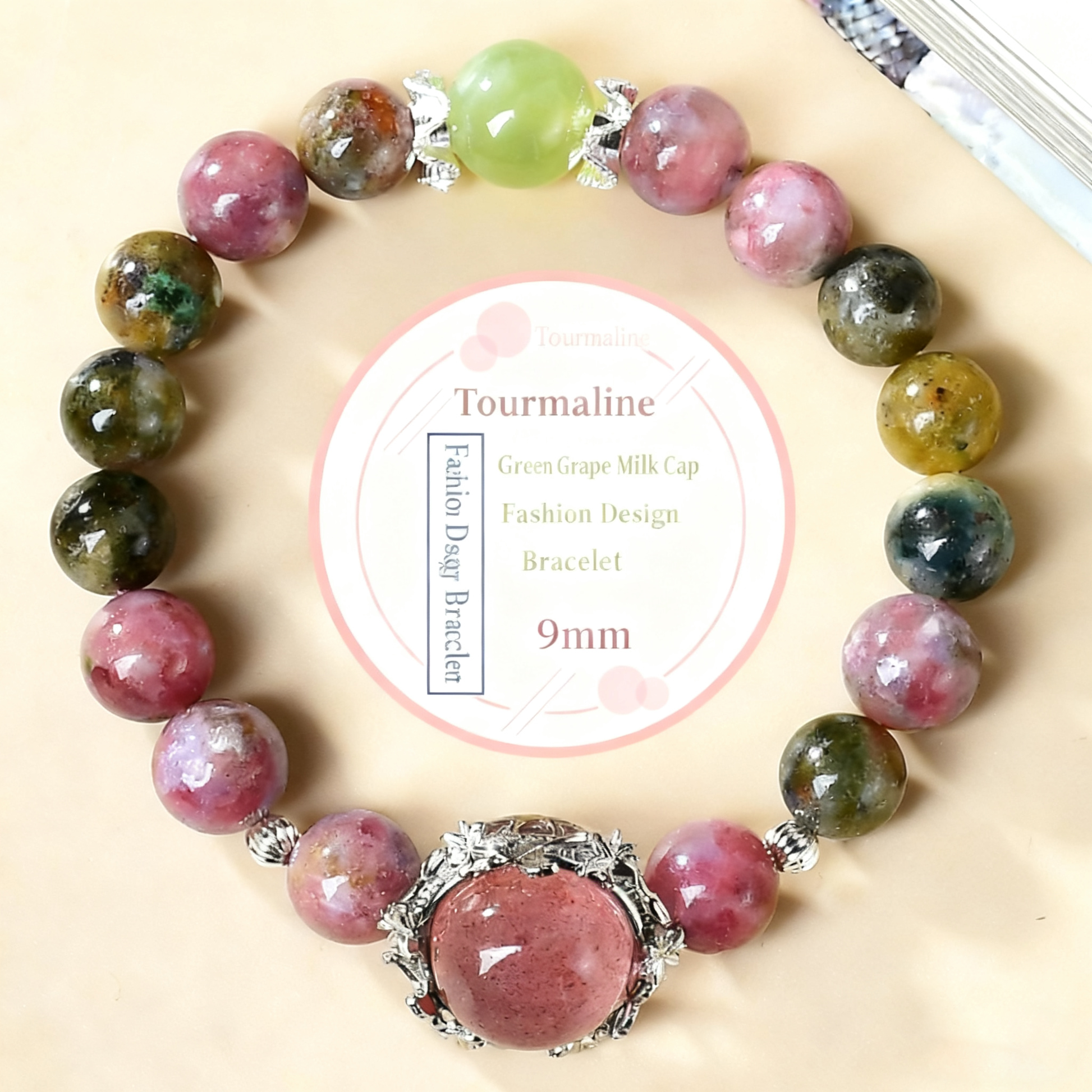 The magic box design bracelet made alternately of tourmaline and strawberry crystal showcases its unique arrangement and emotional healing power