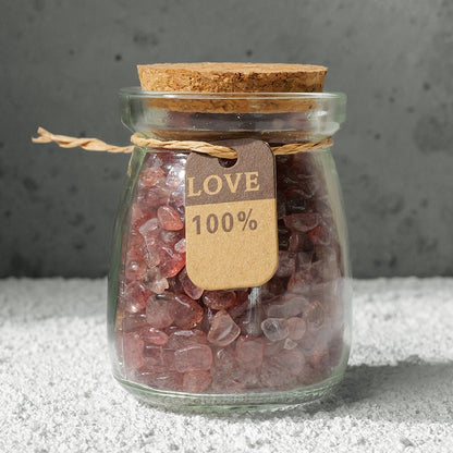 Crystal bottles are placed in the creative workspace, surrounded by scattered design sketches, inspiring creativity.