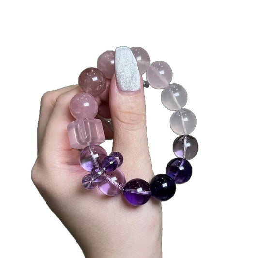 A tiled pattern of a gradient bracelet from amethyst to rose quartz and then to white quartz, showcasing the soft color transition and energy flow