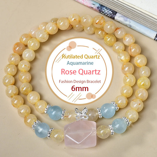 A bracelet featuring a mix of golden quartz, aquamarine and rose quartz in various styles showcases the fusion of natural forms and energy