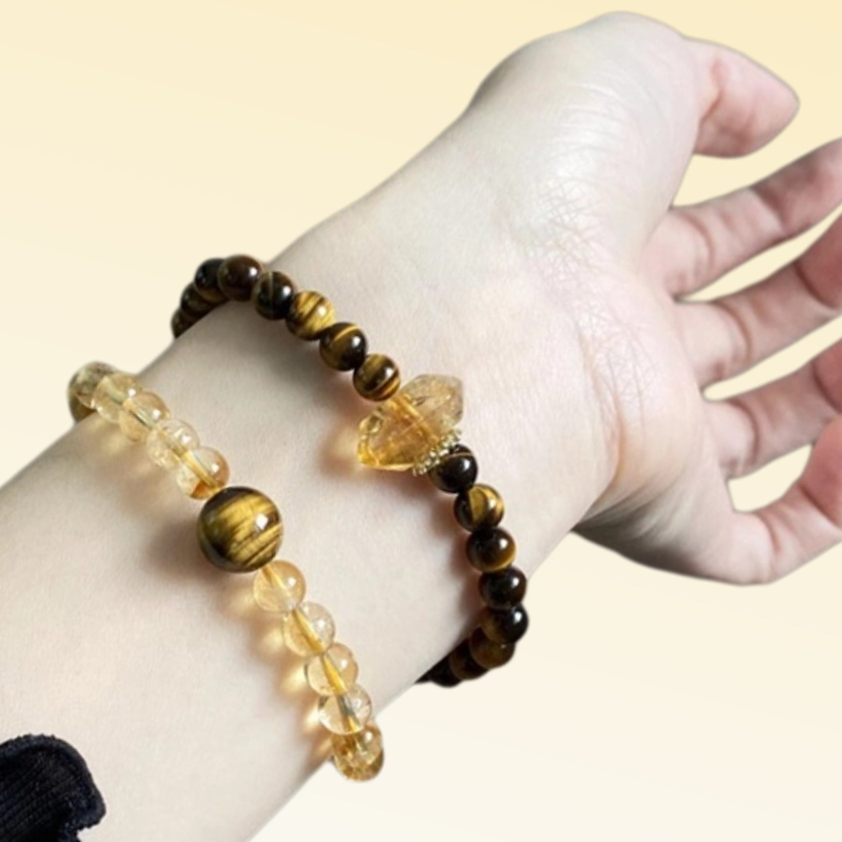 A close-up of yellow tiger's eye and yellow quartz alternately strung together showcases the perfect combination of golden crystals