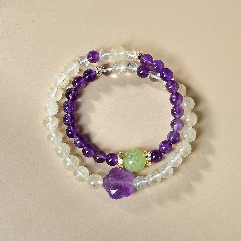 The bracelet is displayed flat, highlighting its dual energy effects of attracting wealth and enhancing wisdom