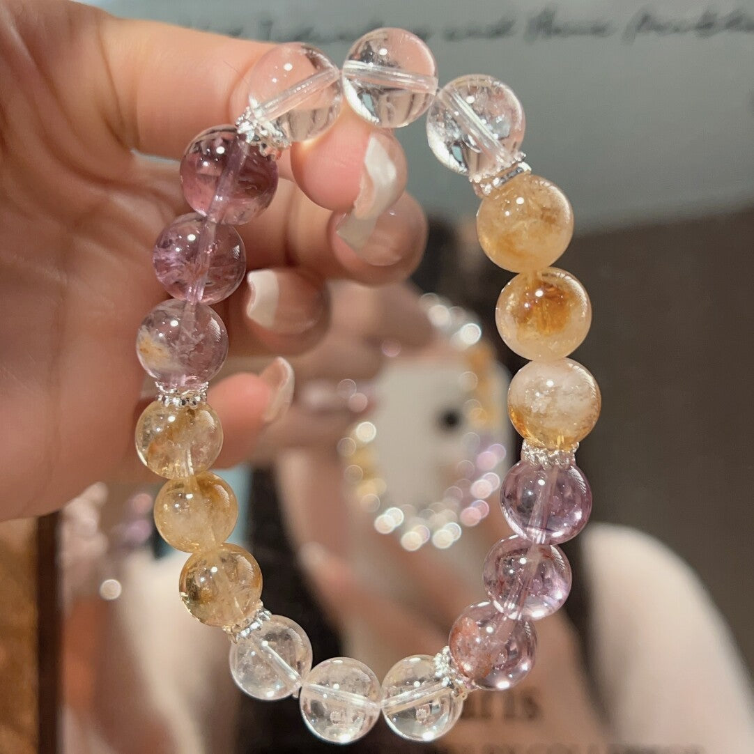 Highlighting the wealth-attracting energy of the yellow tower crystal in the bracelet and the purifying and amplifying effect of the white crystal, it is suitable for entrepreneurs and professionals.
