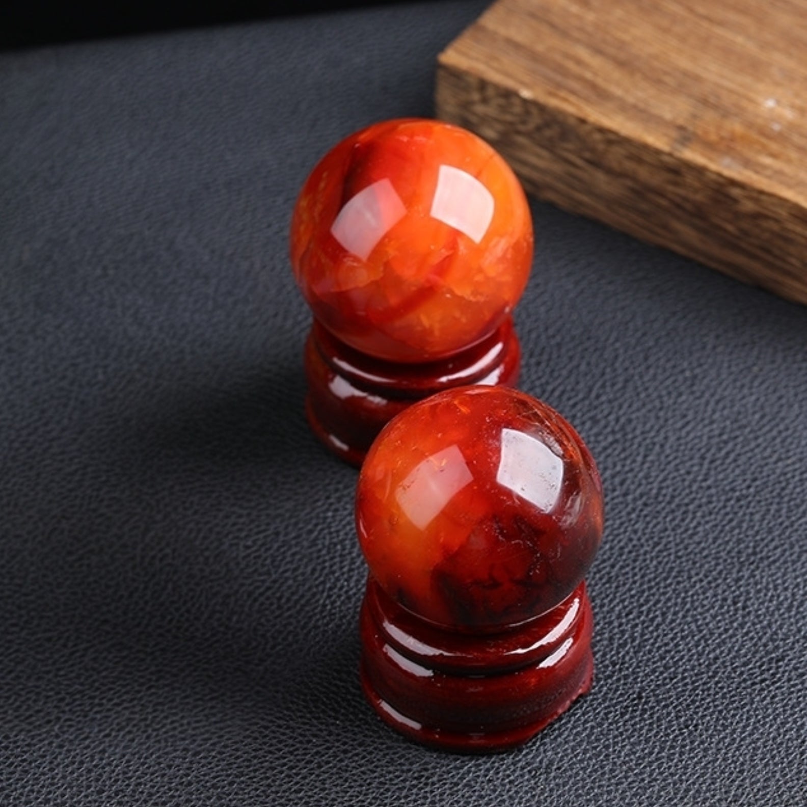 Red agate ball on office desk enhancing work vitality