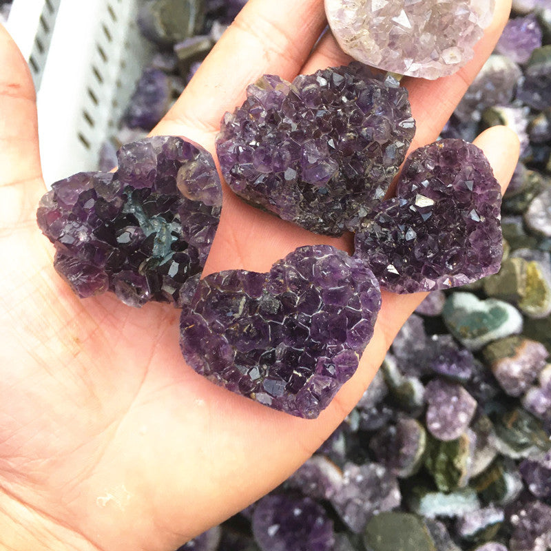 Amethyst clusters shine brightly in natural light