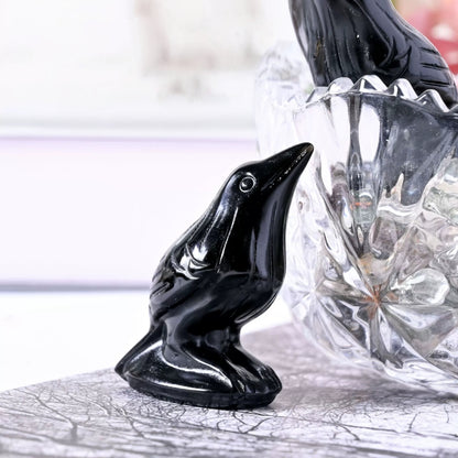 Black obsidian bird sculpture detailed feather carving