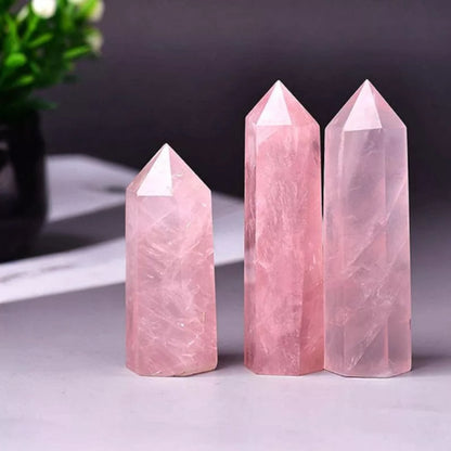 Close-up of Rose Quartz point's facets and termination highlighting natural texture and soft color.