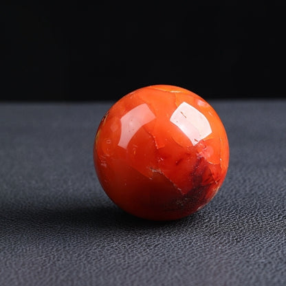 Red agate ball light reflection and transparency effects