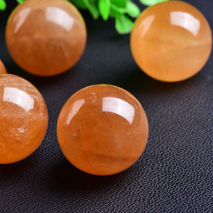 Yellow calcite sphere glowing in sunlight