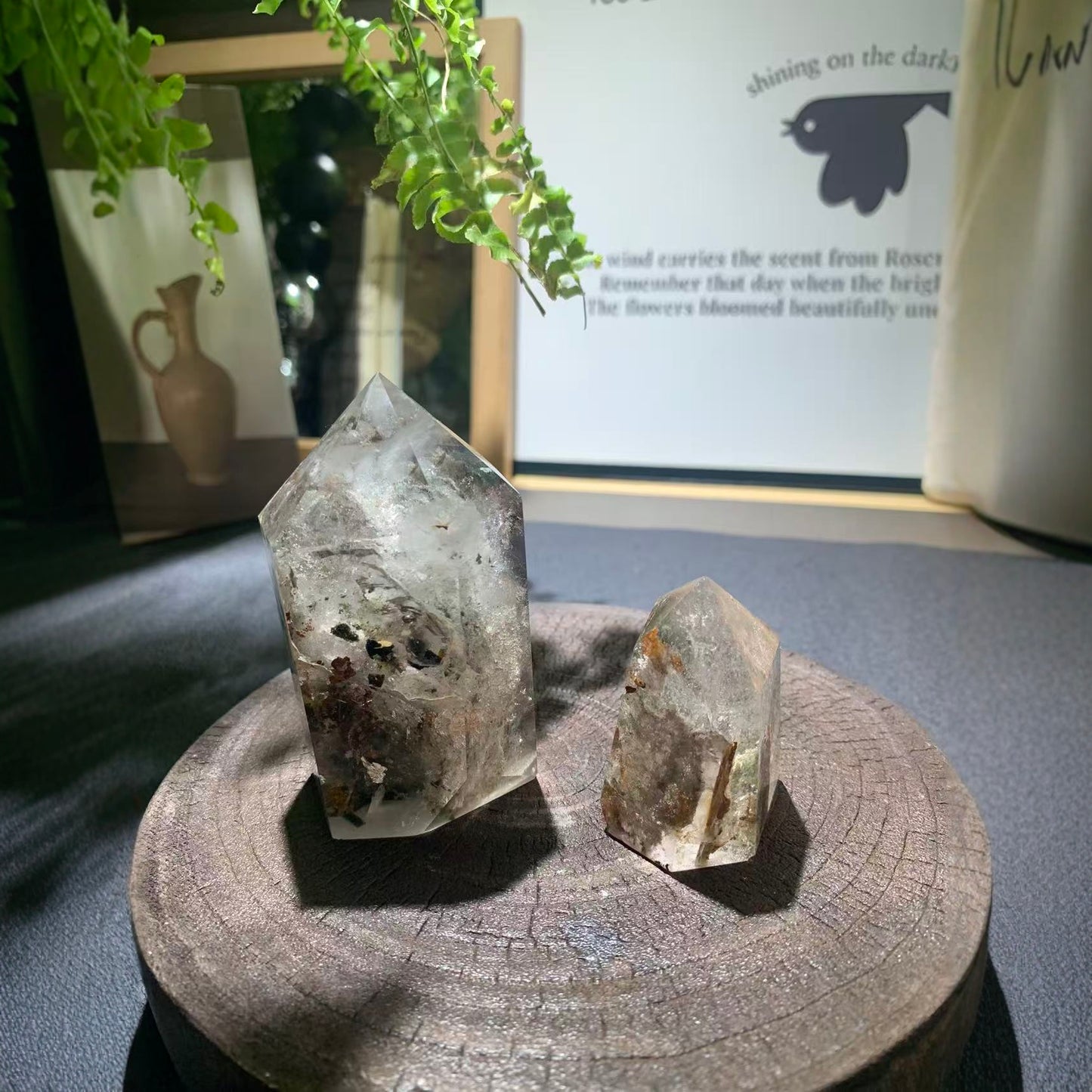 Natural green phantom quartz hexagonal point front view showing phantom inclusions