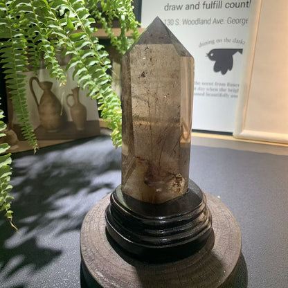 Grounding meditation practice with smoky quartz point