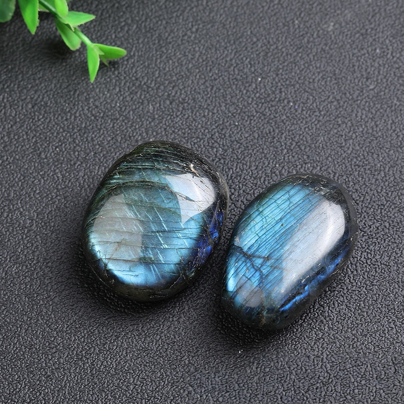 Using labradorite palm stone for stress relief at office desk