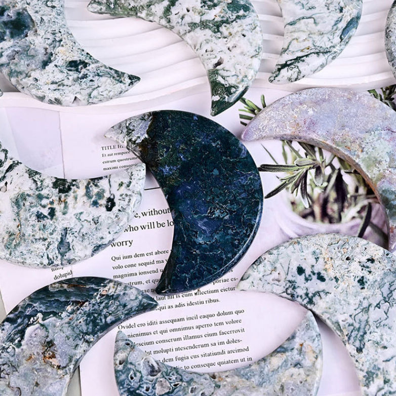 Crystal moon carving displayed on spiritual altar setup