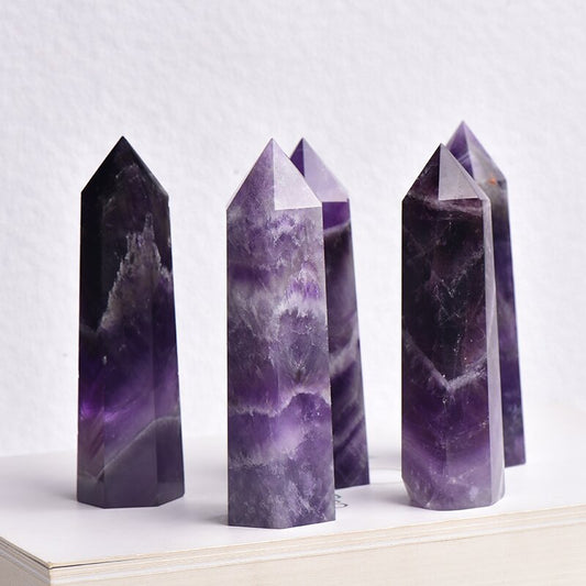 Main product shot of natural amethyst point showing deep purple color and hexagonal cut
