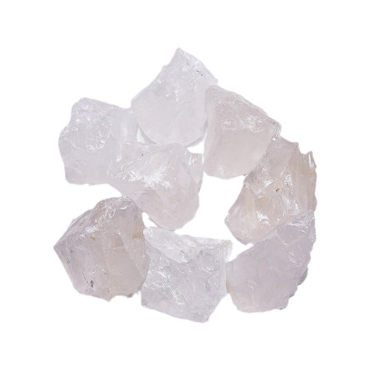 A collection of 3-4 large Natural Clear Quartz raw stones for aromatherapy, on a wooden tray.
