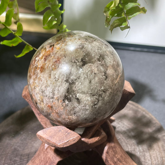 Natural multi-layer phantom quartz sphere with geological patterns