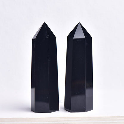 Size comparison of obsidian point showing actual dimensions