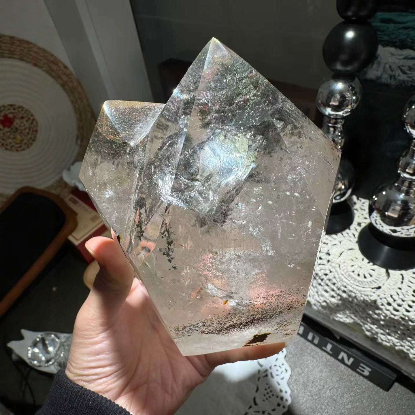 Green phantom crystal displayed on office desk for success