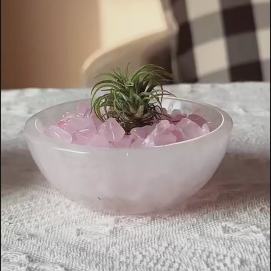 Video demonstrating the versatile uses of the Moroccan Selenite Energy Bowl as a personal Energy Command Center, including guided meditation, charging crystals, acting as an energy guardian in an entryway, and sparking creativity on a desk, with animated scene transitions.