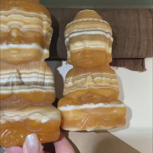 Feel the serene power of this Hand Carved Yellow Calcite Buddha. This video showcases its warm golden glow, intricate carving details, and demonstrates how to incorporate it into your meditation practice and home decor to attract abundance while cultivating inner peace. A perfect blend of art and intention.