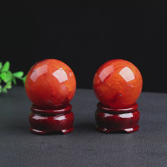 Watch how this natural red agate sphere radiates warm, motivating energy while protecting your space. Perfect for desk decor, meditation, and energy work. Ignite your passion and creativity today!