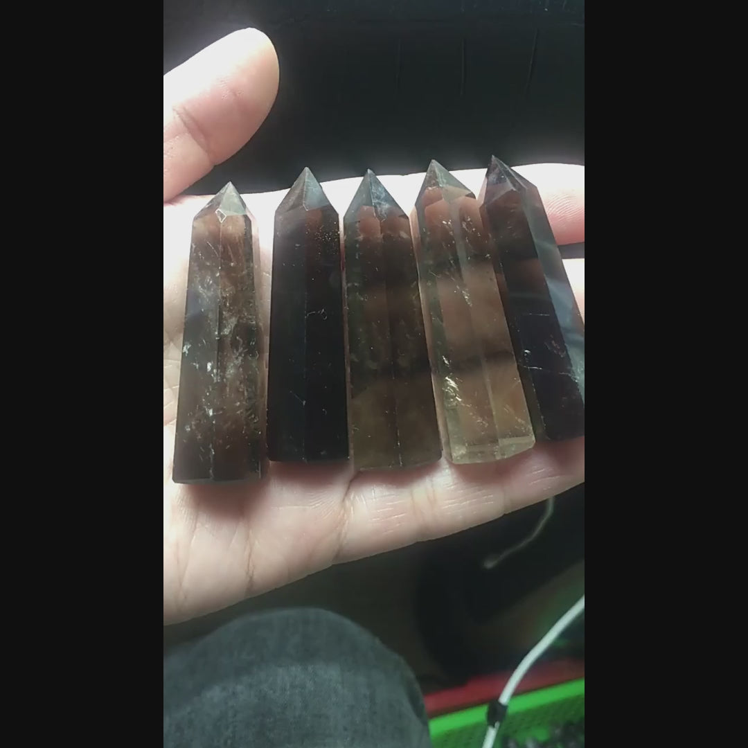 Watch how this natural smoky quartz crystal point directs energy for grounding and protection. Perfect for meditation grids, space clearing, and energy work. Transform your space with earth energy!