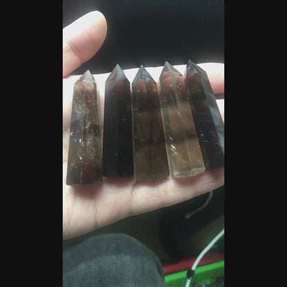 Watch how this natural smoky quartz crystal point directs energy for grounding and protection. Perfect for meditation grids, space clearing, and energy work. Transform your space with earth energy!