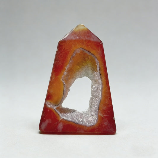 Unveil the hidden world within this Red Agate Geode Square Tower. This video explores its sleek hexagonal polish, delves into the sparkling crystal cave, and shows versatile ways to display it for home decor, Feng Shui, and energy work. See how nature's art enhances modern spaces.