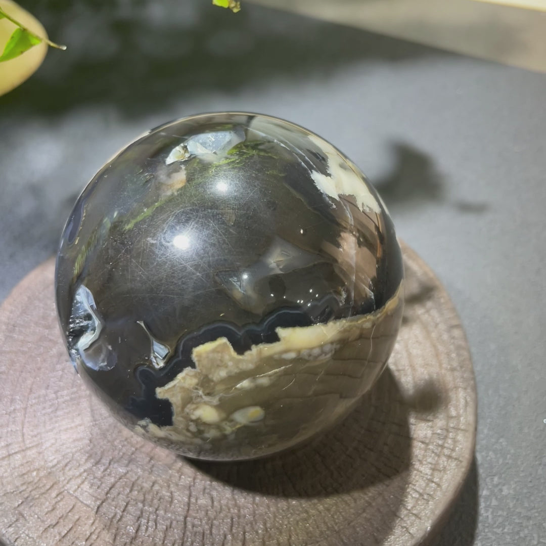 Watch how this volcanic agate sphere radiates powerful grounding energy while showcasing Earth's ancient geological history. Perfect for protection, meditation, and energy balancing. Connect with Earth's core!
