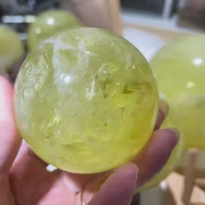 Watch how this citrine sphere radiates golden energy to attract wealth and positive opportunities. Perfect for office success and home abundance.