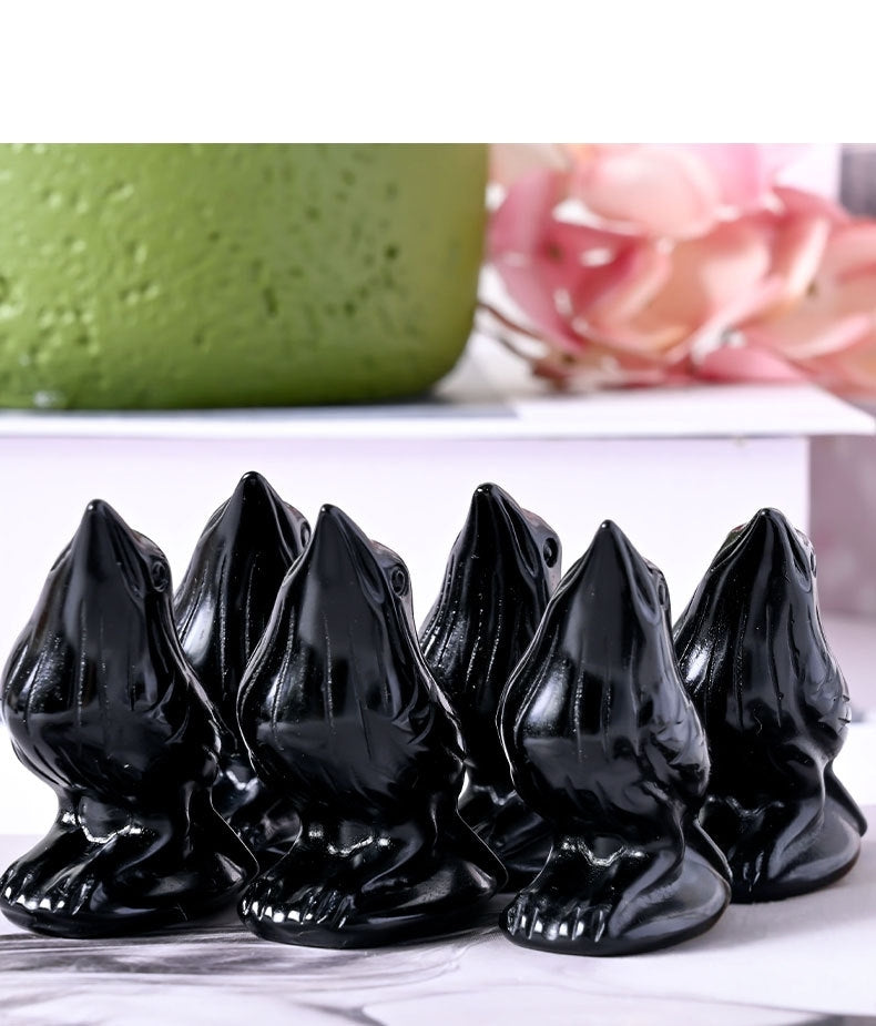 Close detail of raven carving showing craftsmanship