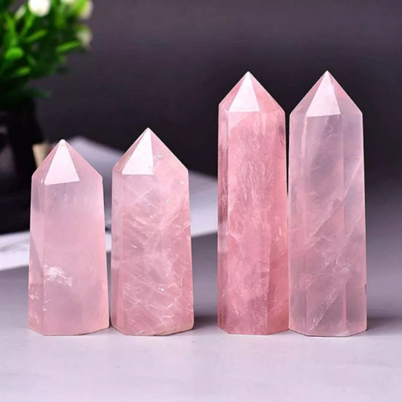 Rose quartz columns are displayed together with amethyst and white quartz for comprehensive healing