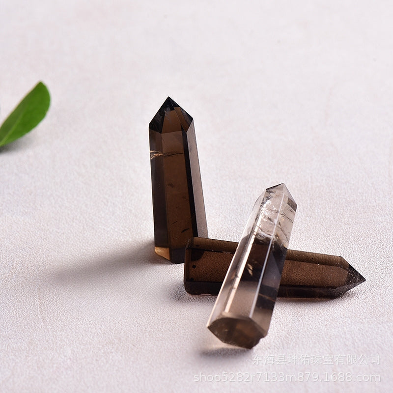 Smoky quartz point placement on desk for stabilizing energy