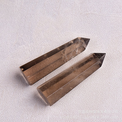 Multiple angles of smoky quartz hexagonal tower showing precise geometry