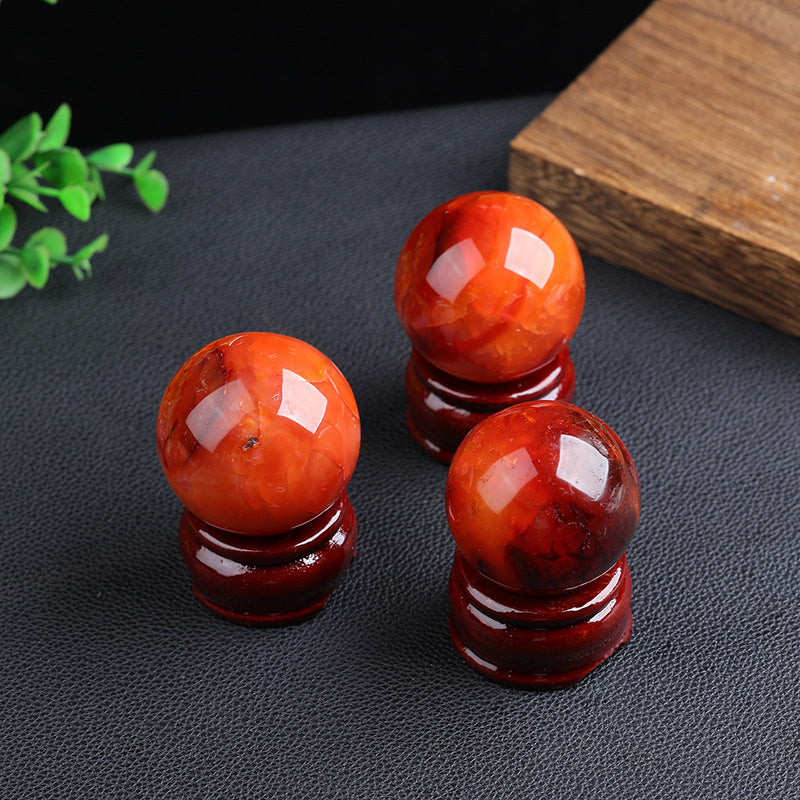 Rotating showcase of red agate perfect spherical shape